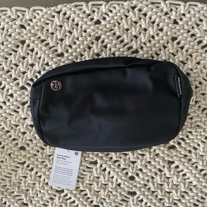 NWT black Lululemon everywhere belt bag with lululemon on strap